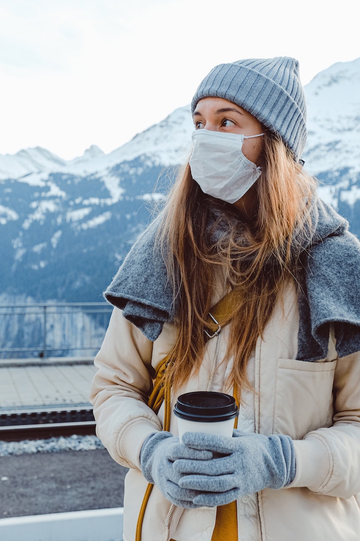 Woman wearing mask in winter outside