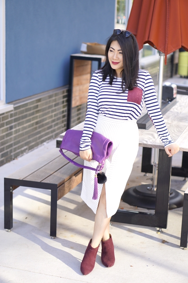 Grace-in-striped-shirt-with-ribbed-white-assymetric-skirt-and-burgundy-shoes