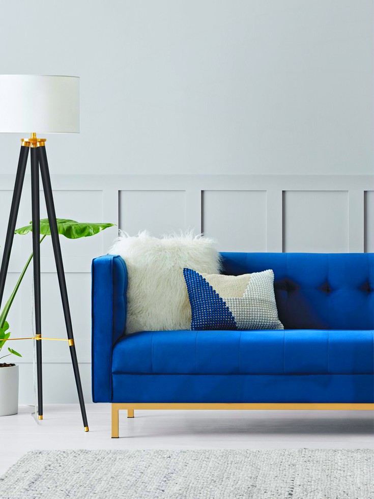 Living room blue sofa and floor lamp