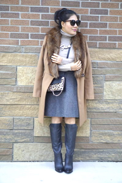 grace in denim skirt, boots and camel coat with fur collar